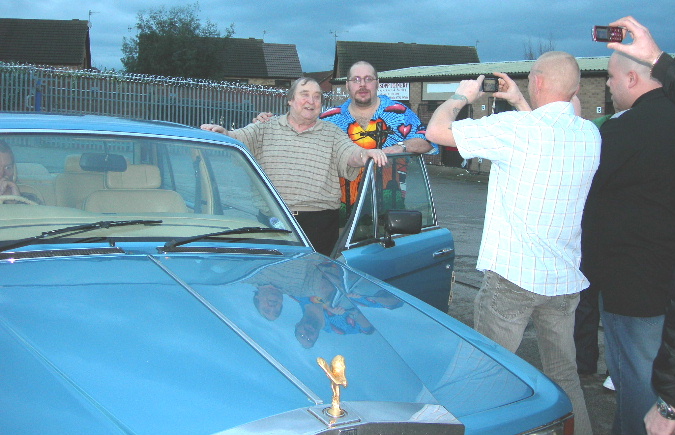 Bernard Manning getting into his car with Pav compere at the Variety club Notts standing along side